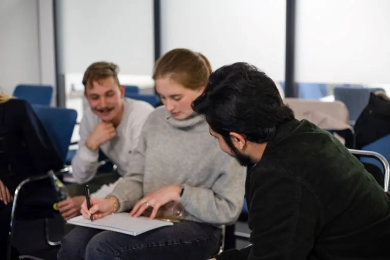 Enactus members collaborating during a workshop