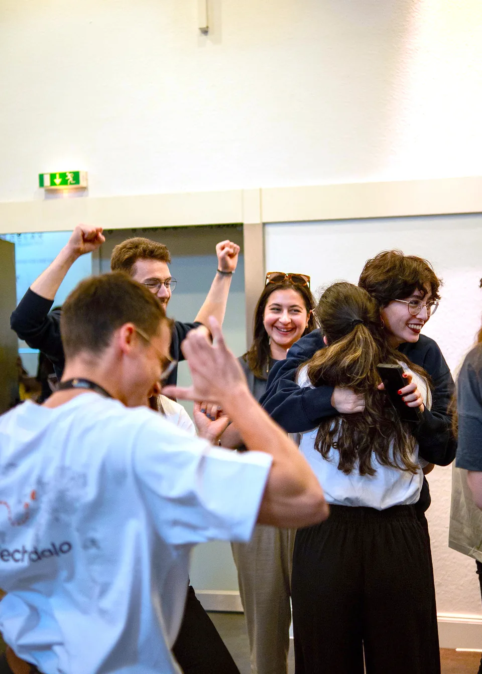 Enactus Munich team members hugging and celebrating together