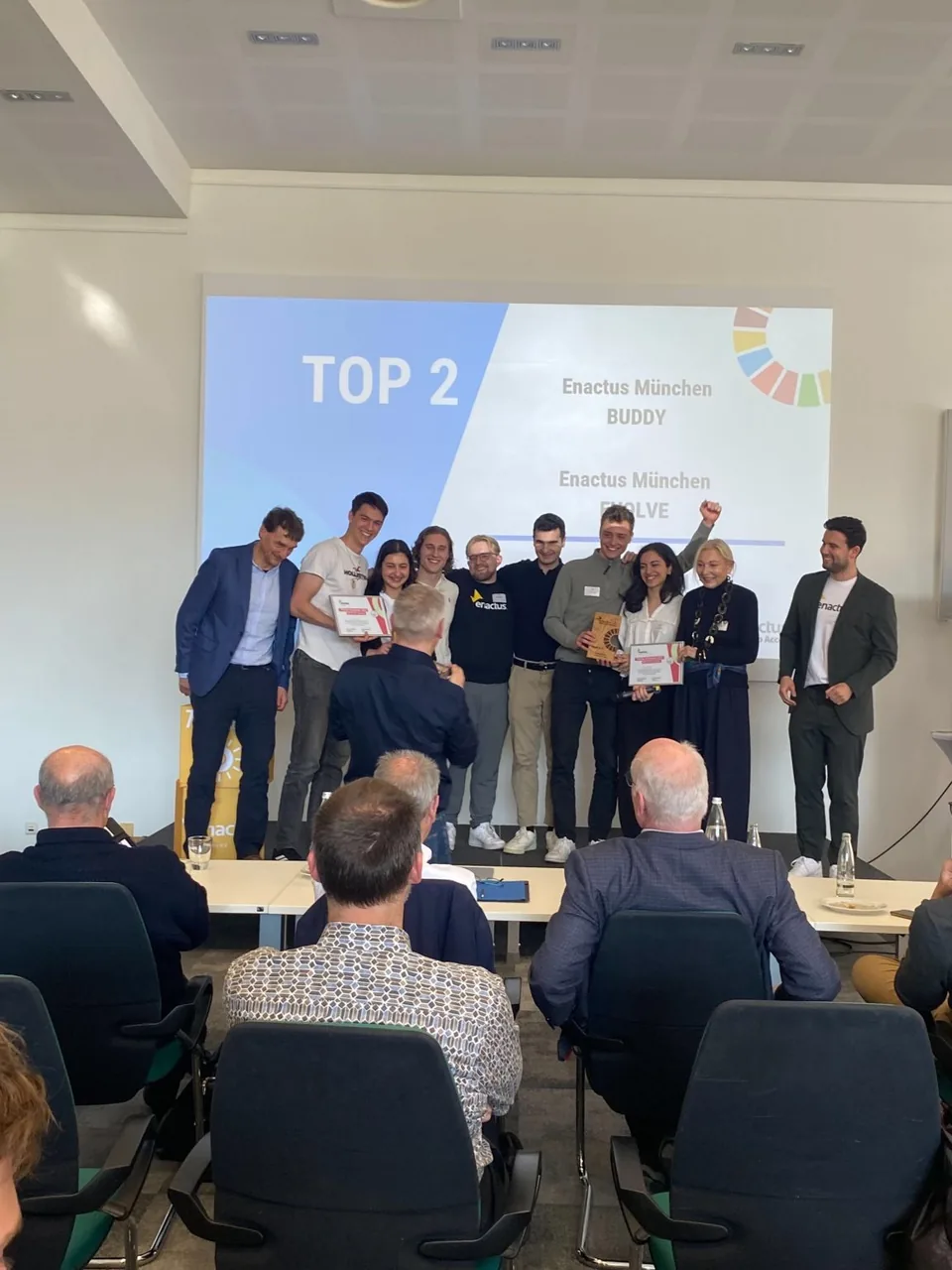Enactus Munich teams Buddy and Evolve at a competition award ceremony